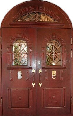 Стальная арочная дверь со стеклом и ковкой ДА-30 в дом из кирпича в Красногорске